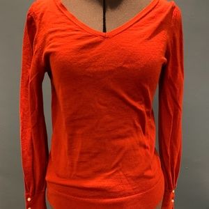 Orange Ann Taylor sweater with sleeve detail